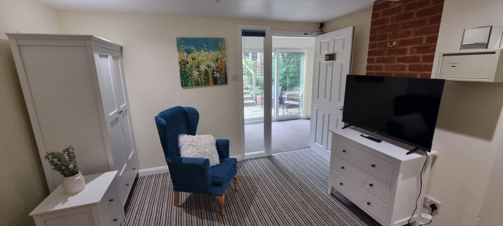 Blue bedroom with patio doors